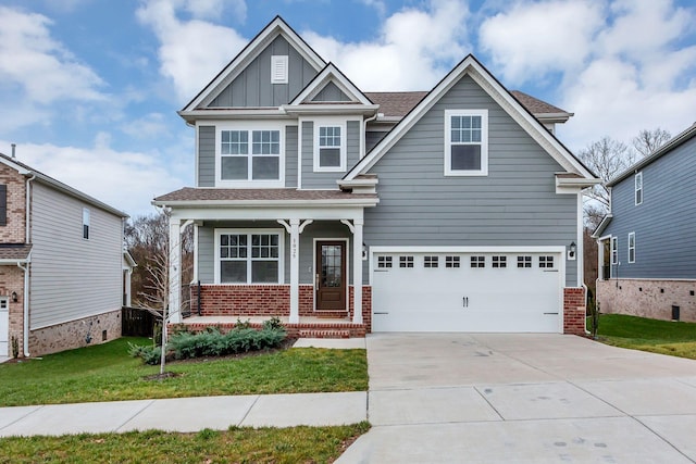 craftsman house featuring a front lawn, covered porch, and a garage