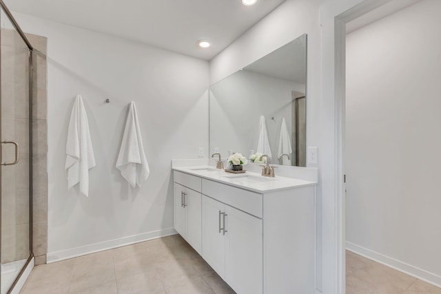 bathroom with vanity, tile patterned floors, and an enclosed shower