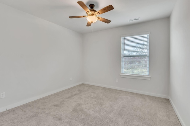 carpeted empty room with ceiling fan