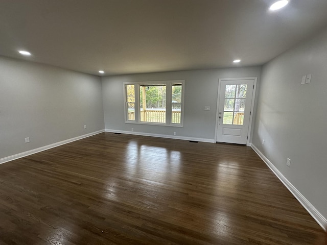 spare room featuring dark hardwood / wood-style floors