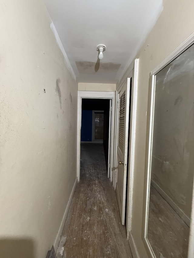 corridor featuring dark hardwood / wood-style floors