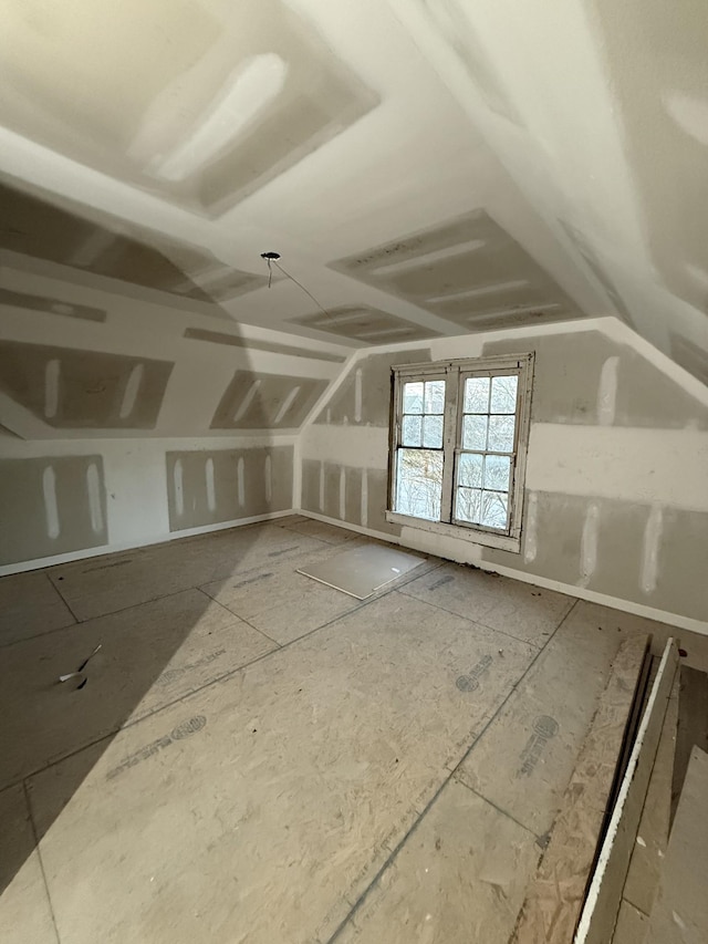 bonus room featuring vaulted ceiling