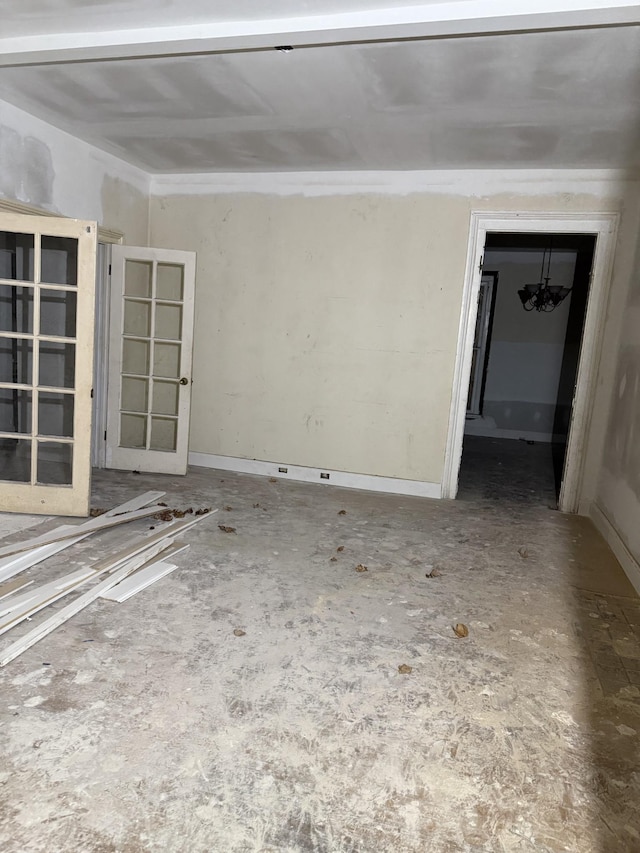 empty room with an inviting chandelier