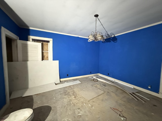 unfurnished room featuring a chandelier and crown molding