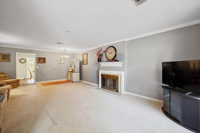 carpeted living room featuring ornamental molding, a fireplace, and a chandelier