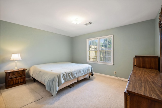 bedroom with light carpet