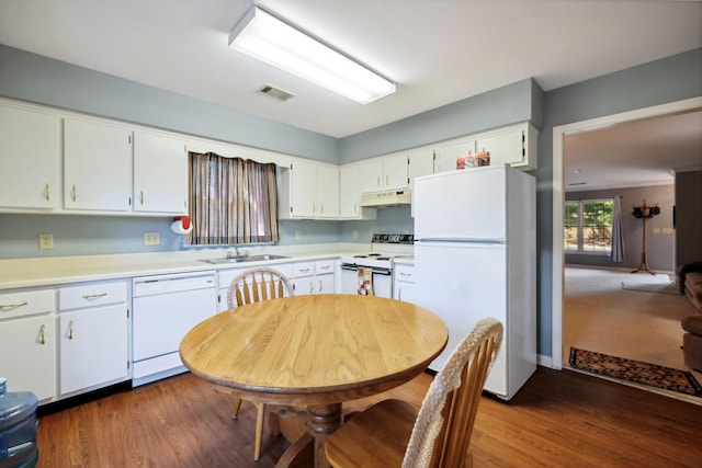 kitchen featuring dark hardwood / wood-style floors, white cabinetry, white appliances, and sink