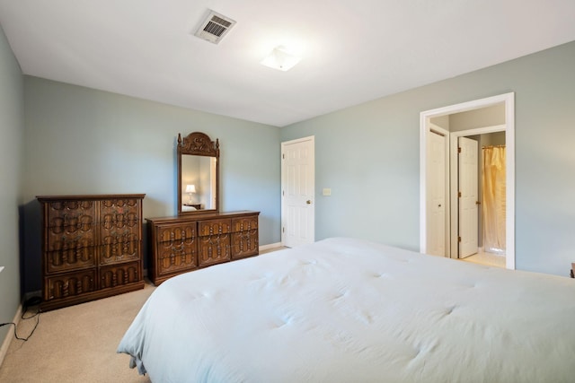 bedroom featuring light colored carpet