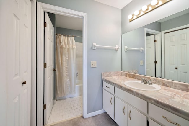 bathroom featuring vanity and shower / bath combination with curtain