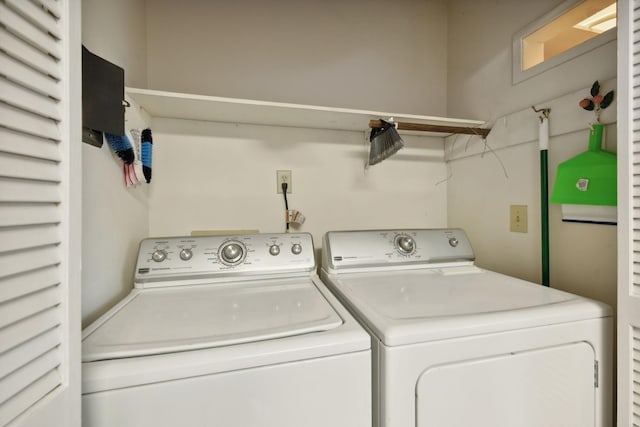 washroom with separate washer and dryer