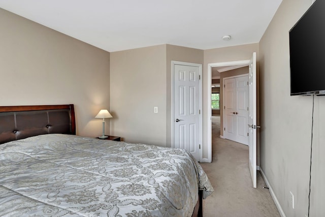 bedroom with light carpet