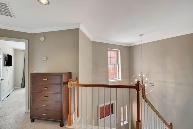 corridor featuring light carpet, crown molding, and an inviting chandelier