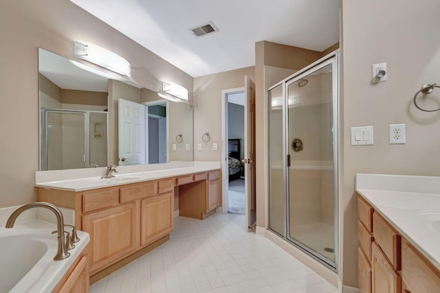 bathroom featuring vanity and separate shower and tub