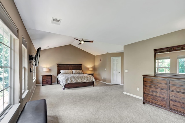 carpeted bedroom featuring ceiling fan and vaulted ceiling