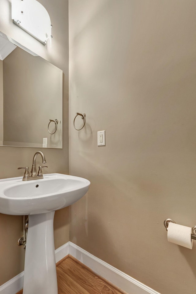 bathroom featuring hardwood / wood-style flooring and sink