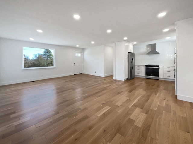 unfurnished living room featuring light wood-type flooring