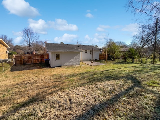 back of house with a yard