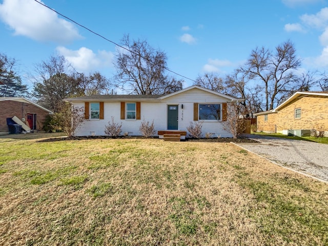 ranch-style home with a front yard