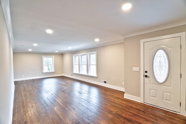 entrance foyer featuring crown molding and dark hardwood / wood-style flooring