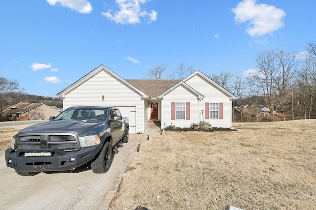 view of front facade with a garage and a front yard