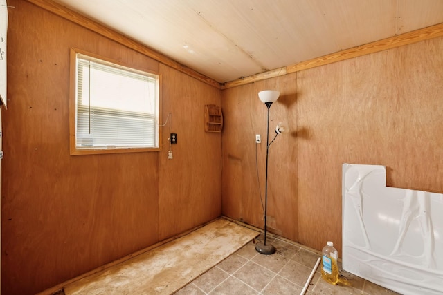 doorway featuring wood walls