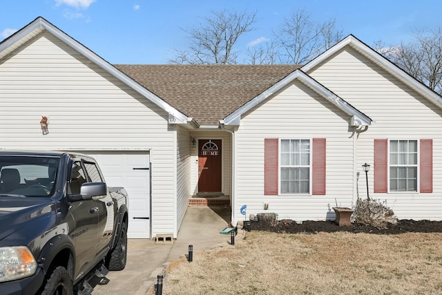 single story home featuring a garage and a front lawn