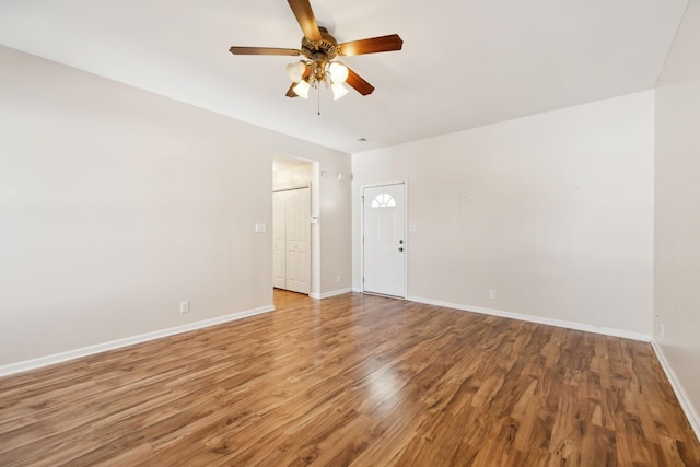 empty room with wood-type flooring and ceiling fan