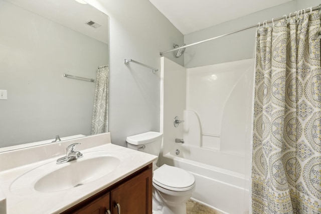 full bathroom featuring vanity, shower / tub combo with curtain, and toilet