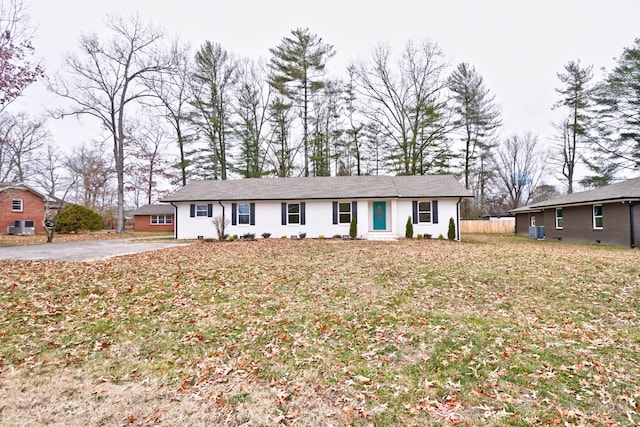 ranch-style home featuring a front yard and central AC