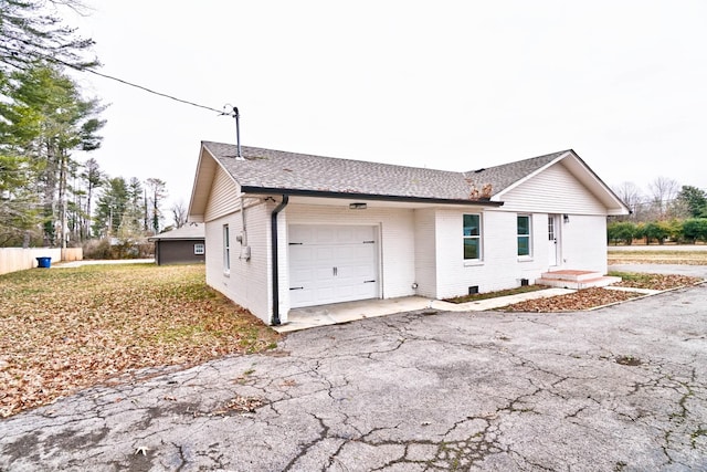 view of side of home with a garage