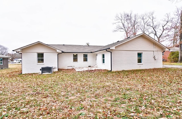 rear view of house with central AC