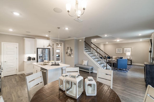 dining room featuring an inviting chandelier, dark wood-type flooring, and crown molding