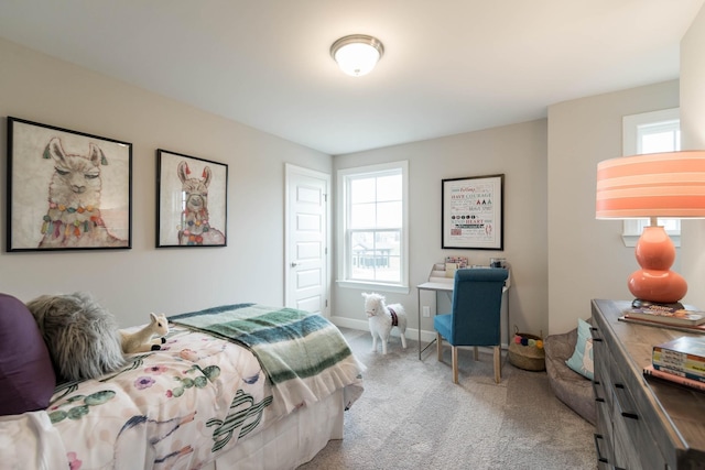 bedroom featuring light colored carpet