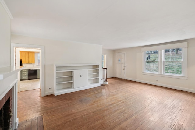 unfurnished living room featuring hardwood / wood-style flooring