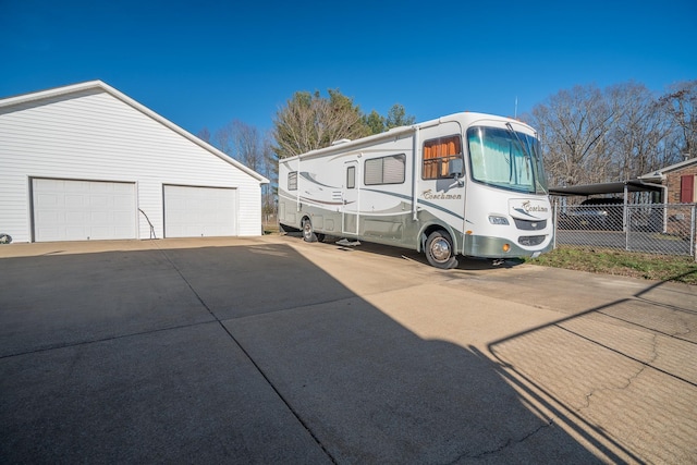 view of home's exterior with an outdoor structure and a garage