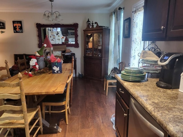 dining area featuring dark wood-type flooring, a chandelier, and ornamental molding