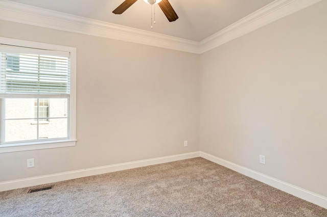 unfurnished room with carpet floors, ceiling fan, and crown molding