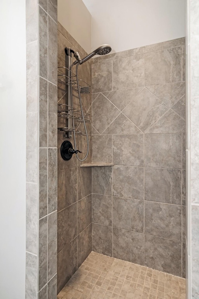 bathroom with tiled shower