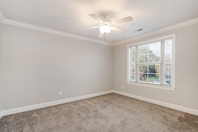 empty room with carpet flooring, crown molding, and ceiling fan