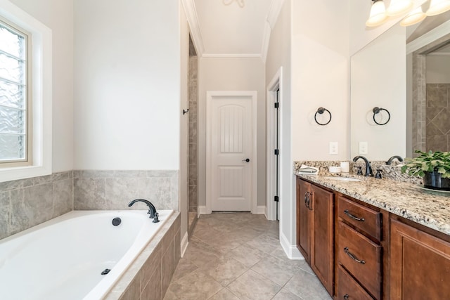 bathroom with tile patterned floors, vanity, independent shower and bath, and ornamental molding