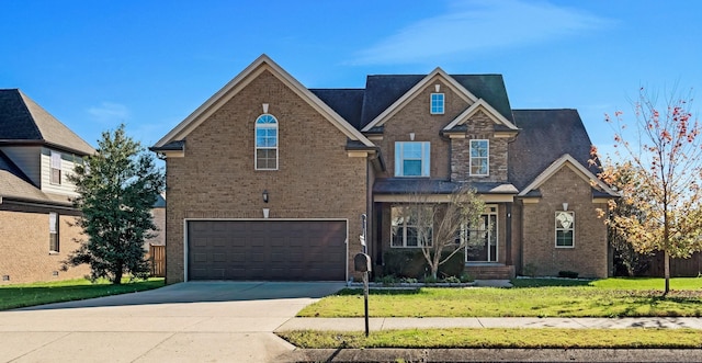 view of front of home featuring a garage and a front yard