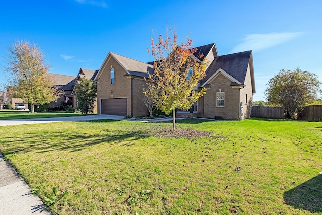 view of front facade featuring a garage and a front lawn