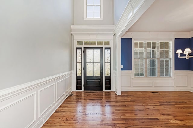 foyer entrance with dark hardwood / wood-style floors