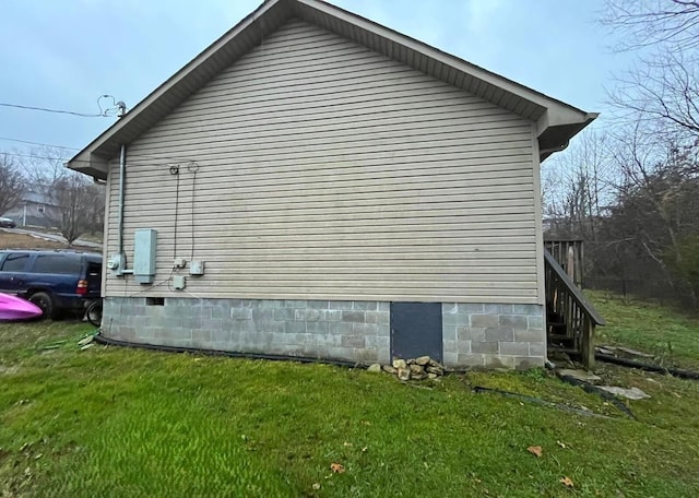 view of property exterior featuring a lawn