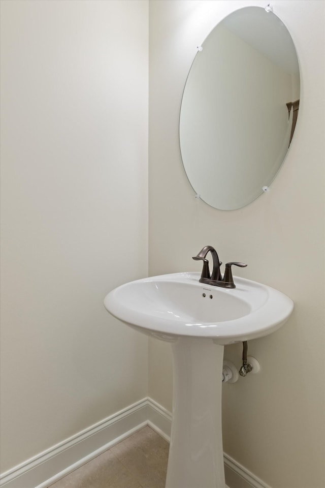 bathroom with tile patterned floors and sink