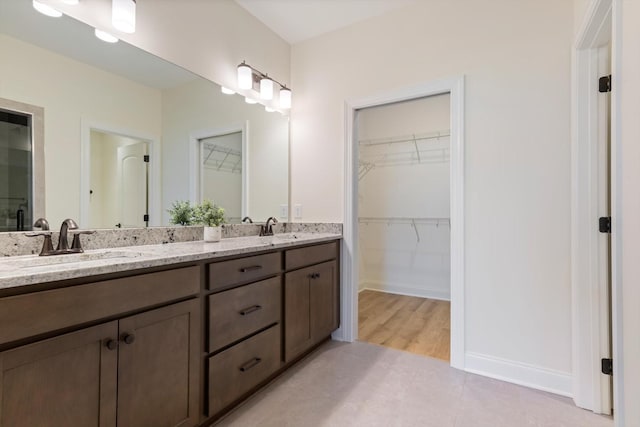 bathroom featuring tile patterned floors and vanity