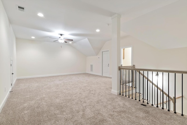 additional living space featuring ceiling fan, carpet, and lofted ceiling