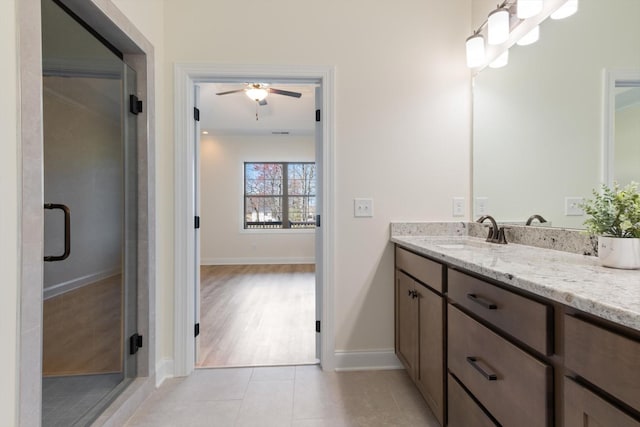 bathroom featuring vanity, tile patterned floors, ceiling fan, and ornamental molding