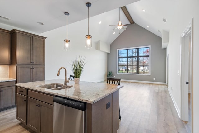 kitchen featuring dishwasher, sink, ceiling fan, light wood-type flooring, and light stone countertops