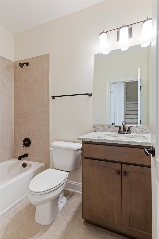 full bathroom featuring tile patterned flooring, vanity, toilet, and tiled shower / bath